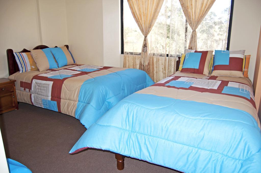 Hotel Residencial El Viajero Tababela Quarto foto